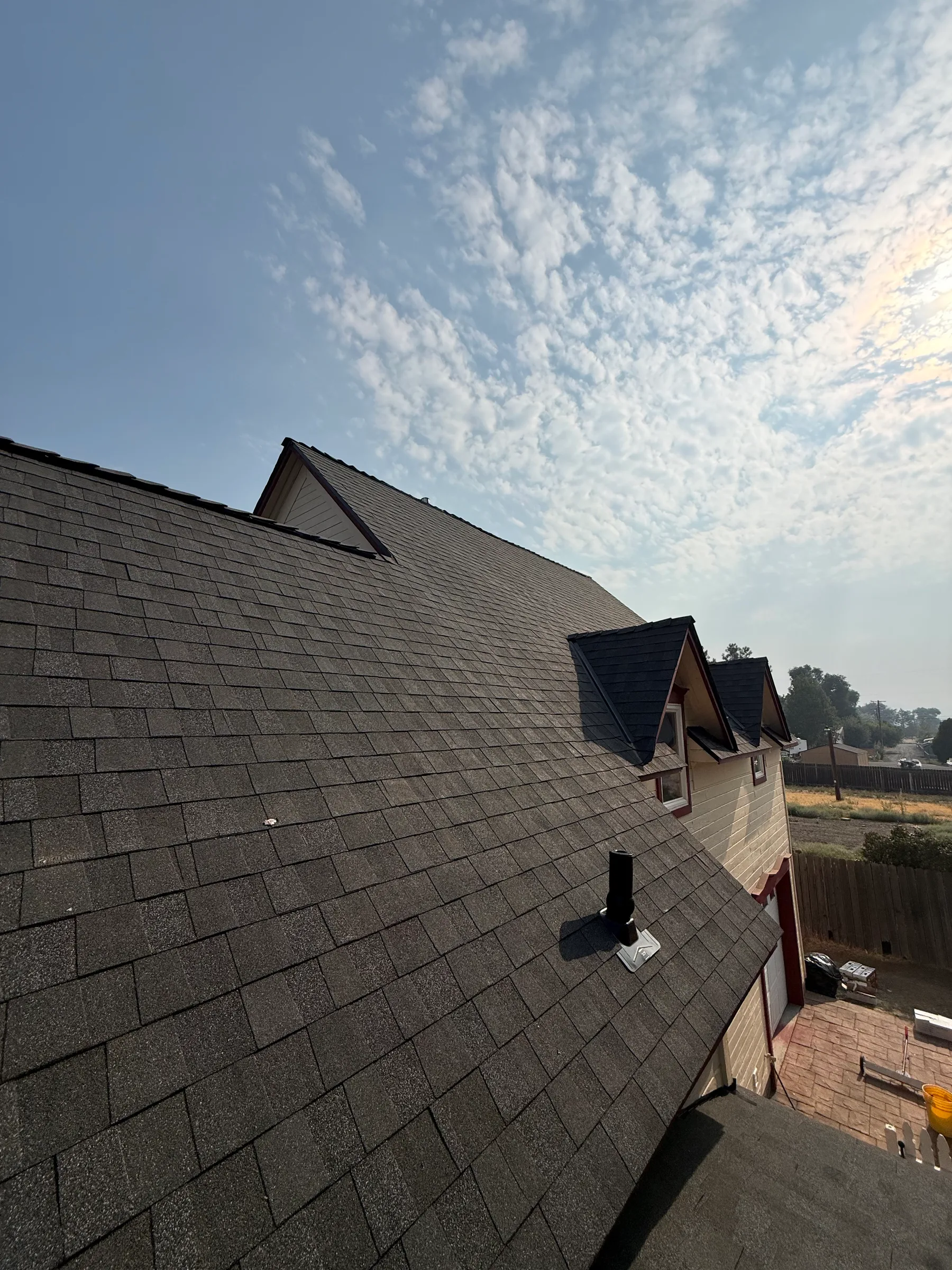 Shingle roof with dormers on a residential home