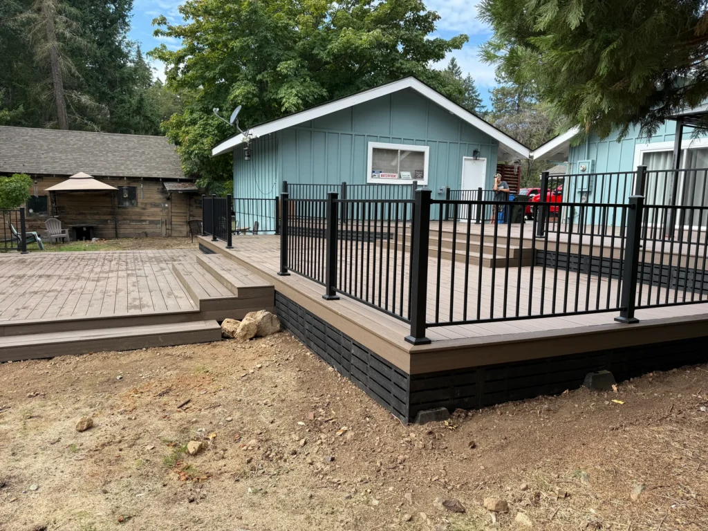 Multi-level residential deck with steps and dark railings