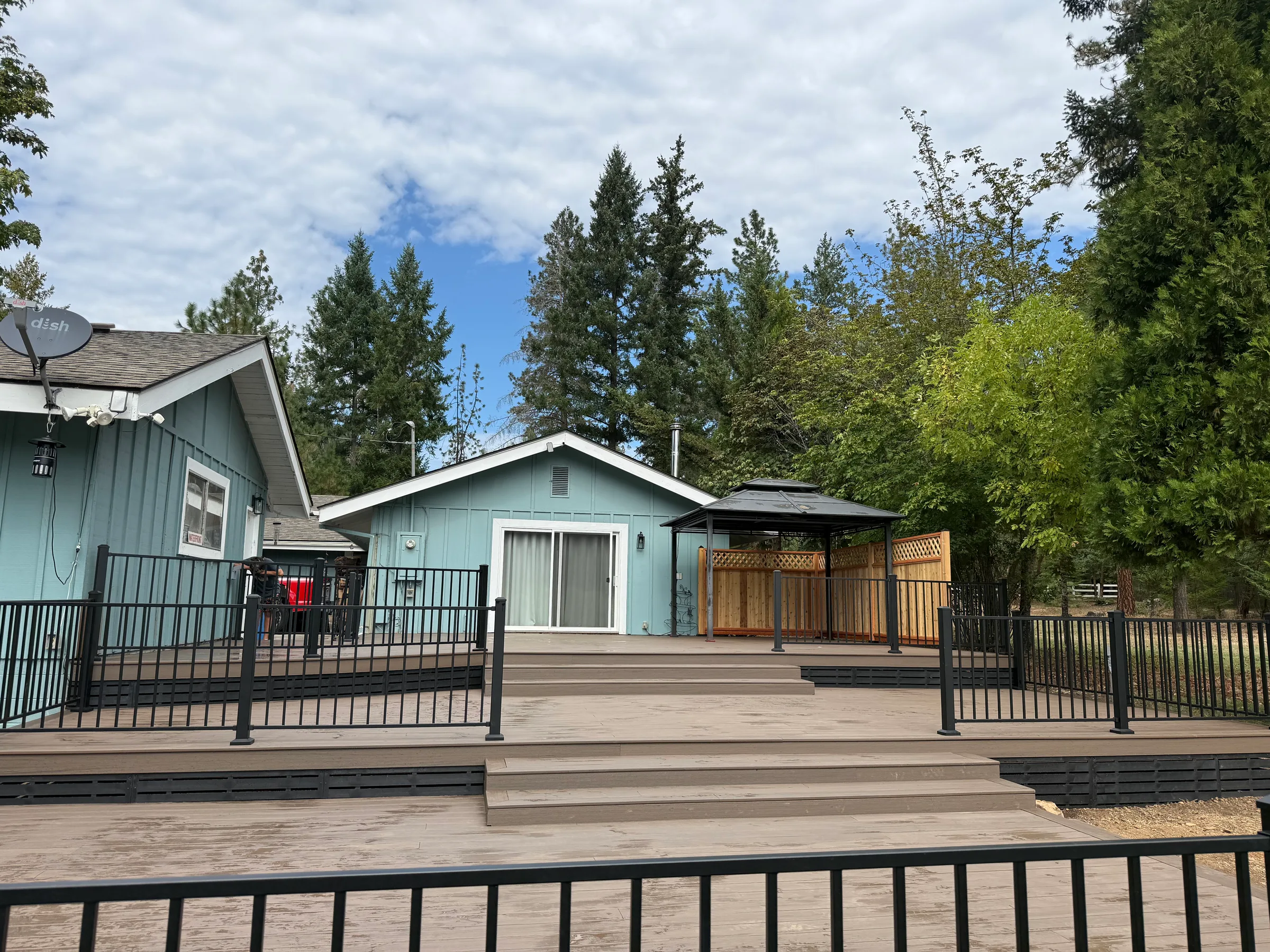 Multi-level residential deck with dark railing